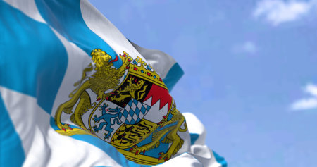 The flag of Bavaria waving in the wind on a clear day. Bavaria is a state in the south-east of Germanyの写真素材