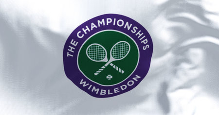 London, UK, April 2022: Close up of The Championships Wimbledon flag waving in the wind. Wimbledon...