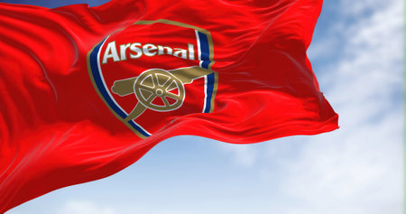 London, UK, May 2022: The flag of Arsenal Football Club waving in the wind on a clear day. Arsenal is a professional football club based in Islington, London, Englandのeditorial素材