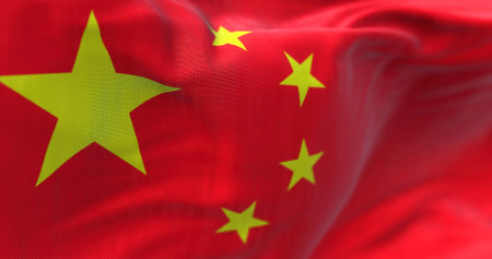 Close-up view of the Chinese national flag waving in the wind. China is a country in East Asiaの写真素材