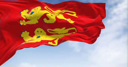The flag of Normandy region waving in the wind on a clear day. Normandy is the northwesternmost of the eighteen regions of Franceの写真素材