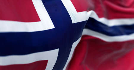 Close-up view of the Norway national flag waving in the wind. Norway is a Nordic country in Northern Europeの写真素材