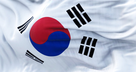 Close-up view of the South Korea national flag waving in the wind. The Republic of Korea is a...