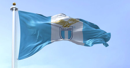 Rome, Italy, July 2022: Close up of the flag of SS Lazio waving. SS Lazio is a professional football club based in Rome. Fabric textured background. Selective focusのeditorial素材