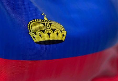 Close-up view of the Liechtenstein national flag waving. The Principality of Liechtenstein is a Central European State. Fabric textured background. Selective focus. 3D illustrationの写真素材