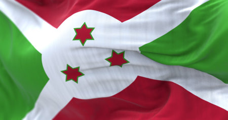 Close-up view of the Burundi national flag waving in the wind. The Republic of Burundi is a country...