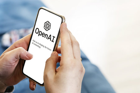 San Francisco US, Dec 2022: Female hands holding a phone with the OpenAI webpage on the screen. Interior shot. OpenAI is a non-profit artificial intelligence research organization. Technology conceptのeditorial素材