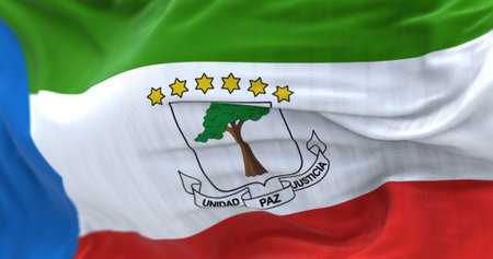 National flag of Equatorial Guinea waving in the wind. The Republic of Equatorial Guinea is a...
