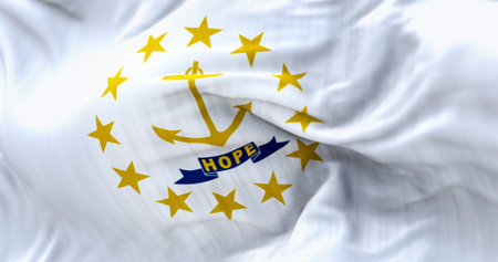 Close-up of the Rhode Island state flag waving. Gold anchor in the center surrounded by thirteen gold stars. Rippled fabric. Textured background. Selective focus. Realistic 3d illustrationの写真素材