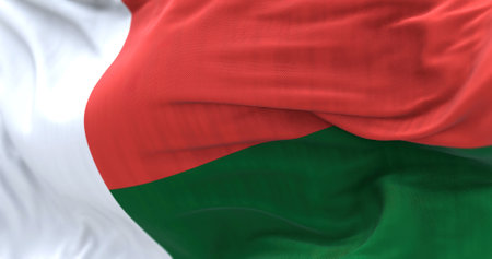 Detail of Madagascar National flag waving. 3 equal rectangles, red, white and green. 3d illustration render. Selective focus. Close-up. Textured backgroundの写真素材