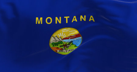 Close-up of Montana state flag waving. Blue flag with coat of arms in the center. 3d illustration render. Close-up. Textured fabric backgroundの写真素材
