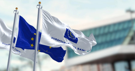 Frankfurt, DE, March 2023: Three Flags of the European Central Bank and European Union waving in the wind with the ECB seat blurred on background. Illustrative editorial 3d illustration renderのeditorial素材