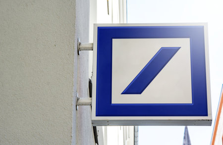 Munish, DE, March 2023: logo of Deutsche Bank on a square metal sign outside a building. Deutsche...