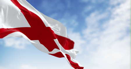 The state flag of Alabama waving in the wind on a clear day. Saint Andrewâs cross on a white background. 3D illustration render. Rippled textileの写真素材