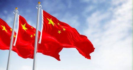 Three flags of China waving on a sunny day. Red background, five yellow stars. The largest star symbolizes the guidance of the Chinese Communist Party. 3D illustration render. Rippled fabricの写真素材