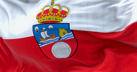Detail of the Cantabria flag waving in the wind. Cantabria is an autonomous community of Spain. White and red horizontal stripes with coat of arms. 3d illustration render. Selective focus. Close-upの写真素材