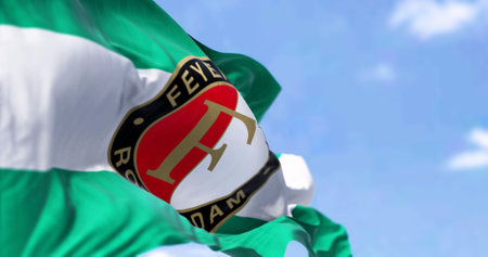 Rotterdam NED, aprile 2023: Close-up view of the Feyenoord Rotterdam flag waving in the wind. Feyenoord is a Dutch football club based in Rotterdam. Illustrative editorial 3d illustration renderのeditorial素材