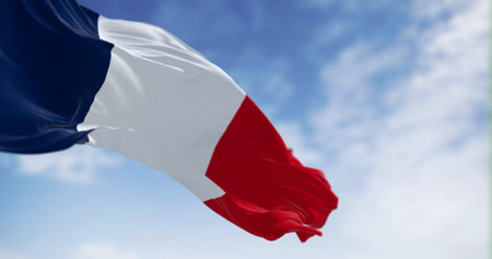 The national flag of France waving in the wind on a clear day. Tricolor of blue, white and red...