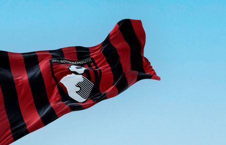 Bournemouth, UK, Oct. 2022: AFC Bournemouth flag waving on a clear day. English football club based...