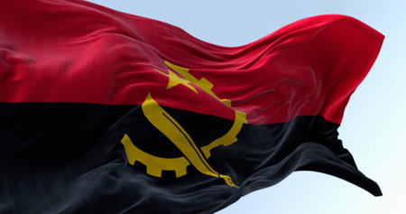 The national flag of Angola waving in the wind on a clear day. Two horizontal bands, red and black, with a yellow emblem in the center. 3d illustration render. Fluttering fabricの写真素材