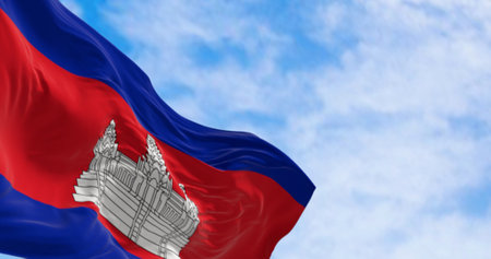 Close-up of Cambodia national flag waving. Three bands, blue, double red, blue, with Angkor Wat in white centered on the red. 3d illustration render. Fluttering fabric. Selective focusの写真素材