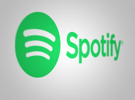 London, UK, oct. 20 2023: green Spotify logo on a white background. Audio streaming and media services provider. Illustrative editorial. Selective focusのeditorial素材