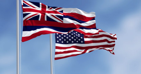 Hawaii state flag waving with the national flag of the United States of America on a clear day. 3d illustration render. Fluttering fabric. Selective focusの写真素材