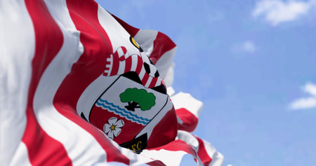 Southampton, UK, October 5 2023: Close-up of Southampton Football Club flag waving in the wind on a clear day. English professional football club. Illustrative editorial 3d illustration renderのeditorial素材