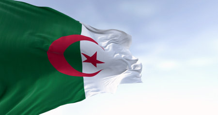 Close-up of Algeria national flag waving on a clear day. two vertical bars, green and white, with a red star and crescent in the center. 3d illustration render. Fluttering fabric backgroundの写真素材