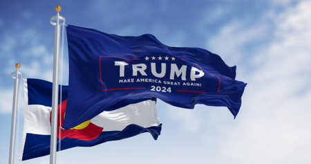 Denver, US, Dec.20 2023: Trump 2024 campaign flag waving with Colorado State flag. On Dec. 2023...