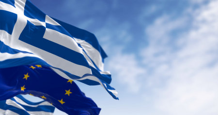 National flags of Greece waving in the wind with flag of the European Union. 3d illustration render....