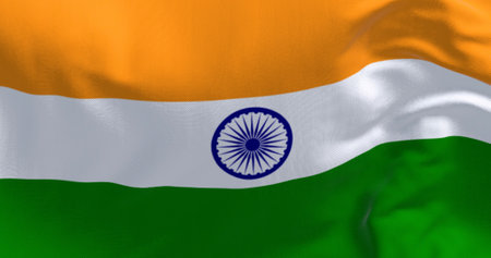 Close-up of India national flag waving. Tricolor of saffron, white and green with a blue Ashoka...