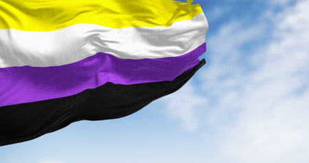 Non-binary flag waving on a clear day. Pride flag that represents the non-binary community. 3d illustration render. Selective focus.の写真素材
