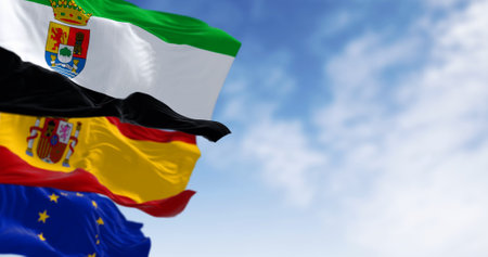 Close-up of the Extremadura flag waving with Spanish and European union flags. Spanish autonomous community. 3d illustration render. Rippled fabric backgroundの写真素材