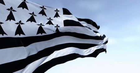 Brittany flag waving with french national flag on a clear day. Brittany is a peninsula, historical country, and cultural area in the west of France. 3d illustration render. Selective focus.の写真素材