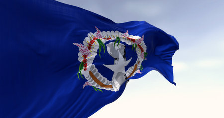 Flag of the Northern Mariana Islands waving in the wind on a clear day. Unincorporated territory of the United States. 3d illustration render. Rippling fabricの写真素材