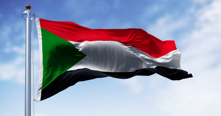 Sudan national flag waving in the wind. Red, white, black horizontal stripes with a green triangle at the hoist. 3d illustration render. Rippling fabricの写真素材