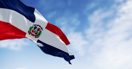 Detail of the national flag of the Dominican Republic waving in the wind on a clear day. Democracy...
