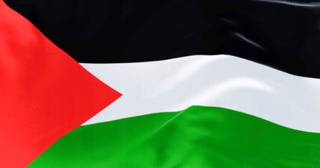 Palestine national flag waving on a clear day. Three black, white, green stripes with red triangle...