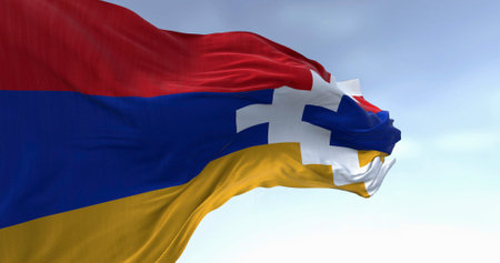 National flag of Artsakh waving in the wind on a clear day. State with limited recognition in the...