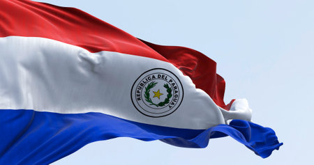 Paraguay national flag waving. Three equal horizontal bands of red, white and blue with an emblem centered in the white band. 3d illustration render. Selective focus. Fluttering fabric. Patriotismの写真素材