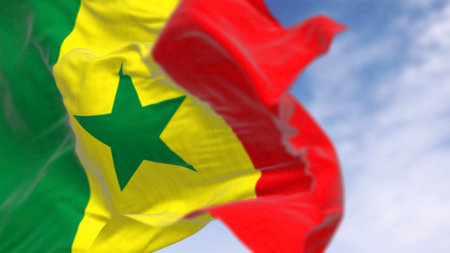 Close-up of Senegal national flag waving on a clear day. Tricolor with vertical bands with the traditional pan-African colors: green, yellow and red. 3d illustration render. Selective focusの写真素材