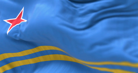 Close-up of Aruba flag waving in the wind. Light blue field, 2 yellow stripes, 4-pointed red star. Colors represent sea, abundance, peace, and origins. 3d illustration render. Selective focusの写真素材