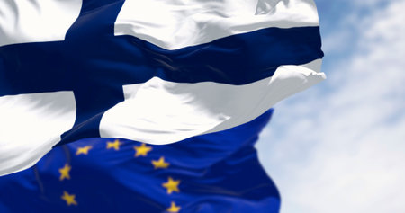 National flag of Finland waving in the wind with European Union flag on a clear day. 3d illustration render. Rippling fabric. Selective focusの写真素材