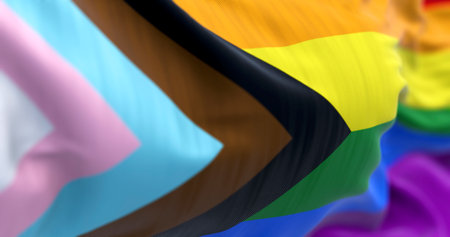 Progress Pride flag waving in the wind, with inclusive colors for LGBTQIA+ identity. A vibrant symbol of equality, acceptance, and solidarity. 3d illustration render. Rippled fabric.の写真素材
