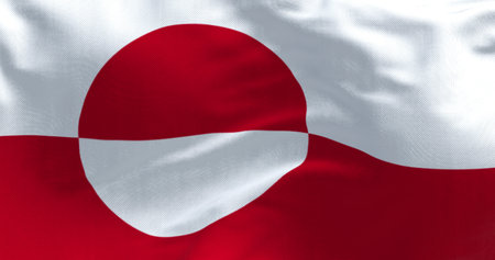 The flag of Greenland waving with its red and white circular design, symbol of Arctic identity, glaciers, and cultural pride. 3d illustration render. Rippled fabricの写真素材