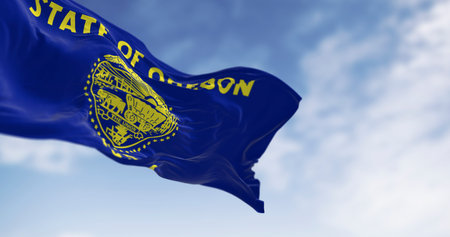 3D render of the Oregon state flag waving in the sky. Featuring the state seal, eagle, and historical symbols. Perfect for themes of freedom, identity, patriotism, and American heritageの写真素材