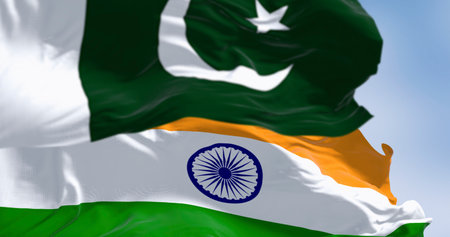 Pakistan and India national flags waving on a clear day. 3d illustration render. Selective focus. Rippling fabricの写真素材