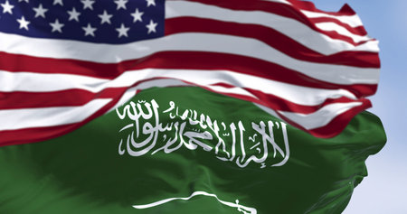 3D render of Saudi Arabia and United States flags waving side by side. Symbol of international identity, patriotism, and cultural unity between East and Westの写真素材