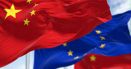 Selective focus on the Chinese flag with the European Union flag blurred in the background. Concept of politics, trade, and diplomacy between China and the EU. 3D illustration.の写真素材